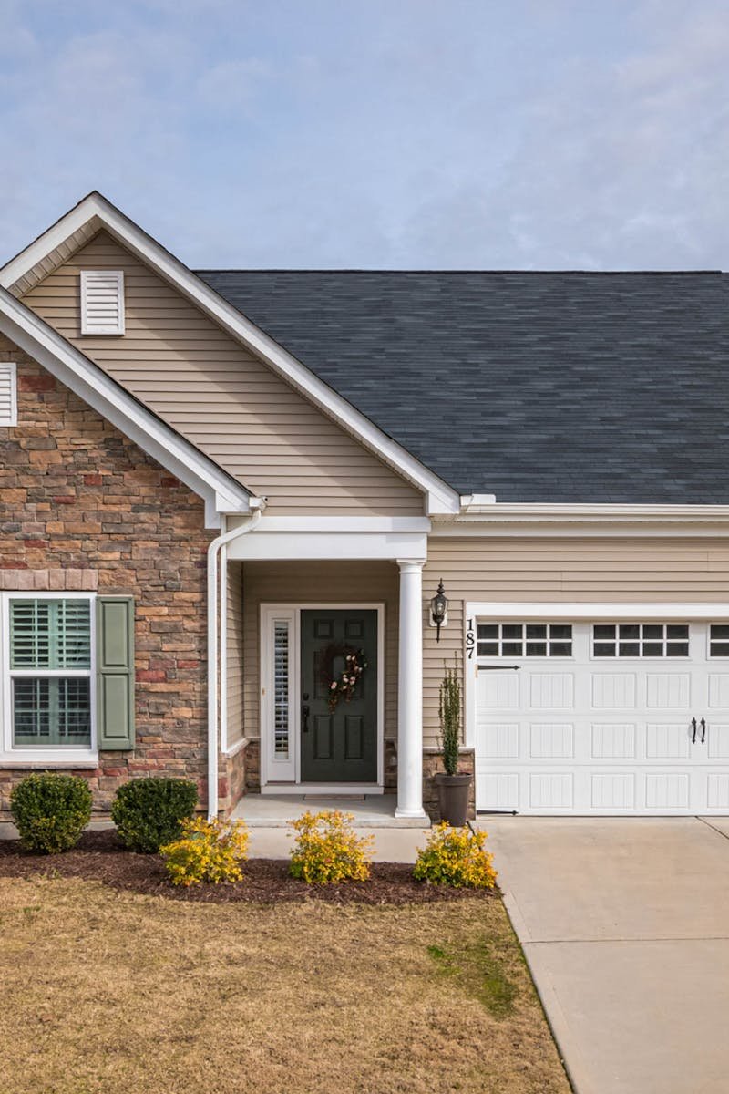 A welcoming suburban family house with a modern facade, perfect for residential living.